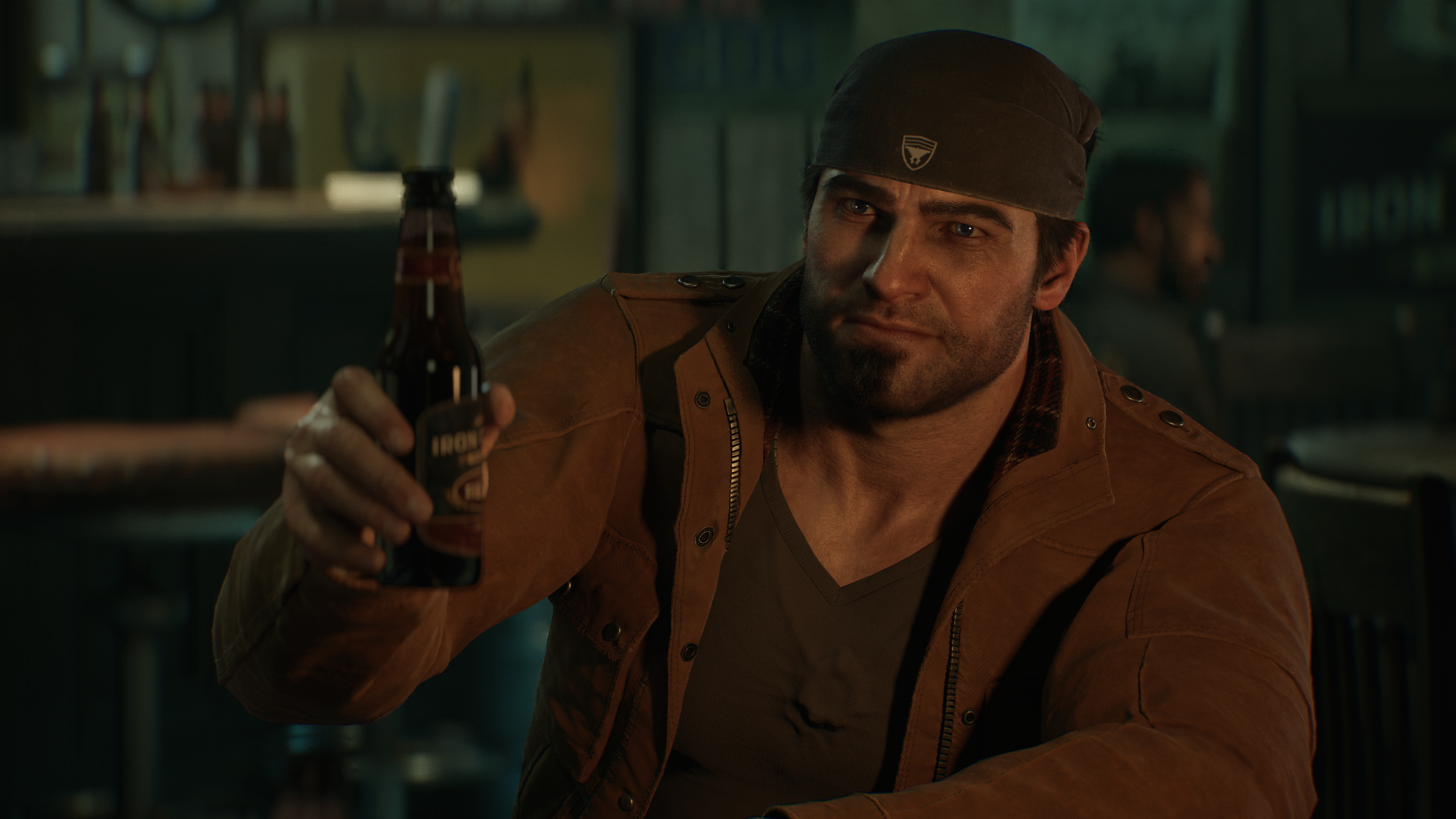 Marcus making a toast with a beer bottle in hand